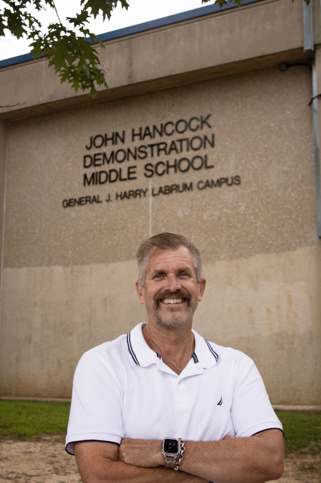Bill Griffin outside John Hancock Demonstration Middle School, General J. Harry LaBrum Campus